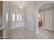 Bright entryway with tile flooring, chandelier, and view into adjacent rooms at 11003 E Kiva Ave, Mesa, AZ 85209