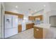 Well-lit kitchen boasts white appliances, plenty of counter space, and ample cabinet storage at 11003 E Kiva Ave, Mesa, AZ 85209