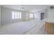 Open-concept living area featuring tile flooring, neutral colors, bright windows and ample natural light at 11003 E Kiva Ave, Mesa, AZ 85209