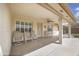 Covered patio with seating, ceiling fan, and view of the backyard, perfect for outdoor living at 11003 E Kiva Ave, Mesa, AZ 85209