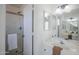 Bright bathroom with a glass shower, white vanity and updated fixtures at 1247 W Boxelder Cir, Chandler, AZ 85224