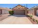 Lovely single-level home boasting desert landscaping and an attached two-car garage at 1247 W Boxelder Cir, Chandler, AZ 85224