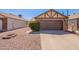 Cozy one-story house features a neatly maintained yard and a convenient two-car garage at 1247 W Boxelder Cir, Chandler, AZ 85224