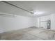 Clean garage featuring water heater, storage, and an automatic door opener at 1247 W Boxelder Cir, Chandler, AZ 85224