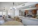 Open floorplan view into kitchen and dining area from living room at 1247 W Boxelder Cir, Chandler, AZ 85224