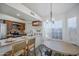 Kitchen featuring an island, stainless appliances, and tiled floors at 1247 W Boxelder Cir, Chandler, AZ 85224