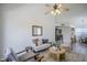 Living room view showcasing open floorplan with view into kitchen at 1247 W Boxelder Cir, Chandler, AZ 85224