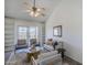 A bright living room featuring a ceiling fan and lots of seating at 1247 W Boxelder Cir, Chandler, AZ 85224