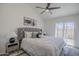 Comfortable main bedroom with stylish headboard and sliding glass doors at 1247 W Boxelder Cir, Chandler, AZ 85224