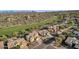 Aerial view of a luxury homes overlooking a golf course with mountain views at 13827 N Mesquite Ln, Fountain Hills, AZ 85268