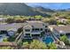 Aerial view displaying outdoor living with a putting green, pool, and patio in a gated community at 13827 N Mesquite Ln, Fountain Hills, AZ 85268