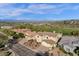 Stunning aerial view of a residential neighborhood with beautiful homes and a lush golf course in the background at 13827 N Mesquite Ln, Fountain Hills, AZ 85268
