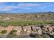 Scenic aerial perspective displays residences nestled within a neighborhood, complemented by a lush green golf course at 13827 N Mesquite Ln, Fountain Hills, AZ 85268