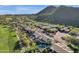 Scenic aerial view showcasing luxury homes in a golf course community with mountain views at 13827 N Mesquite Ln, Fountain Hills, AZ 85268