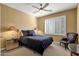 Cozy bedroom with ceiling fan, plush carpet and plantation shutters for a relaxing retreat at 13827 N Mesquite Ln, Fountain Hills, AZ 85268