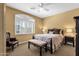 Comfortable bedroom featuring a cozy bed, plantation shutters and neutral color scheme for a relaxing retreat at 13827 N Mesquite Ln, Fountain Hills, AZ 85268