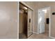 Walk-in closet featuring mirrored doors, built-in cabinets and shelves for maximum storage at 13827 N Mesquite Ln, Fountain Hills, AZ 85268