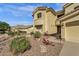 Charming two-story home boasts desert landscaping, creating a warm curb appeal at 13827 N Mesquite Ln, Fountain Hills, AZ 85268