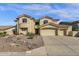 Inviting two-story home features a well-maintained yard, enhancing its curb appeal at 13827 N Mesquite Ln, Fountain Hills, AZ 85268