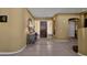 Elegant foyer featuring tile floors, a decorative mirror, console table, and a view of the dark wood front door at 13827 N Mesquite Ln, Fountain Hills, AZ 85268