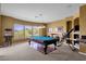 Game room has a pool table, bar, and treadmill for entertaining and recreation at 13827 N Mesquite Ln, Fountain Hills, AZ 85268
