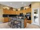 Modern kitchen featuring a kitchen island with seating, granite countertops, and stainless steel appliances at 13827 N Mesquite Ln, Fountain Hills, AZ 85268