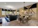 Open-concept living and dining area with custom window decor, tile flooring, and abundant natural light at 13827 N Mesquite Ln, Fountain Hills, AZ 85268