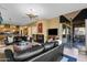 Expansive living room and kitchen area with a sleek fireplace and ample seating, perfect for entertaining at 13827 N Mesquite Ln, Fountain Hills, AZ 85268