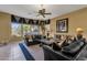 Comfortable living room with tile floors, neutral walls, custom window accents and plush seating at 13827 N Mesquite Ln, Fountain Hills, AZ 85268