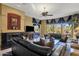Cozy living room features a fireplace, comfortable seating, and views of the outdoor scenery at 13827 N Mesquite Ln, Fountain Hills, AZ 85268