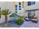 Charming patio area with a decorative fountain, lush greenery, and cozy seating, ideal for outdoor relaxation at 13827 N Mesquite Ln, Fountain Hills, AZ 85268