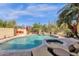 Beautiful backyard pool with a built-in spa, lush landscaping, and ample space for lounging and enjoying the outdoors at 13827 N Mesquite Ln, Fountain Hills, AZ 85268