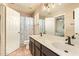 Spacious bathroom featuring a double sink vanity, open shower, and a large mirror that enhances the bright space at 1431 W Mountain Sky Ave, Phoenix, AZ 85045
