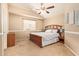 Charming bedroom featuring vaulted ceilings, neutral paint, plush carpet, and a stylish wooden bed frame at 1431 W Mountain Sky Ave, Phoenix, AZ 85045
