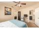 Inviting bedroom showcasing an adjacent office space and an ensuite bathroom, offering comfort and convenience at 1431 W Mountain Sky Ave, Phoenix, AZ 85045