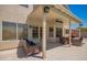 Relaxing covered patio featuring wicker furniture, ceiling fan, and easy access to the home's interior at 1431 W Mountain Sky Ave, Phoenix, AZ 85045