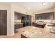 Kitchen features dark cabinetry and a large island with granite countertops at 1431 W Mountain Sky Ave, Phoenix, AZ 85045