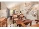 Formal living room area with antique furniture and a staircase at 1431 W Mountain Sky Ave, Phoenix, AZ 85045