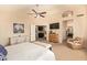 Spacious main bedroom with vaulted ceiling, white furniture, and adjoining bath at 1431 W Mountain Sky Ave, Phoenix, AZ 85045