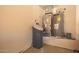 The image showcases an organized utility closet with a water softener, water heater and HVAC Carrier unit at 1431 W Mountain Sky Ave, Phoenix, AZ 85045