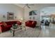 A luxurious living room featuring elegant furnishings, a high ceiling, and a view to other rooms at 14334 W Shawnee Trl, Surprise, AZ 85374