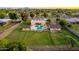 Expansive property featuring a well-maintained yard, pool, and additional structures for versatile living at 1438 E Mesquite St, Gilbert, AZ 85296