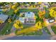 Beautiful aerial view of the property with a circular driveway, pool, and accessory buildings, all set on a spacious lot at 1438 E Mesquite St, Gilbert, AZ 85296
