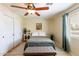 Comfortable bedroom featuring a ceiling fan, neutral paint, and a window for natural light at 1438 E Mesquite St, Gilbert, AZ 85296