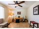 Comfortable music room featuring instruments, a table, ceiling fan, and tile flooring at 1438 E Mesquite St, Gilbert, AZ 85296