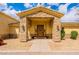 Home's entryway with stone pillars and wood front door at 1438 E Mesquite St, Gilbert, AZ 85296