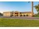Well-maintained single-story home with manicured lawn, stone accents and desert landscaping at 1438 E Mesquite St, Gilbert, AZ 85296