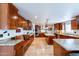 Chef's kitchen with granite countertops, stainless steel appliances, a built-in bench, and custom cabinetry at 1438 E Mesquite St, Gilbert, AZ 85296