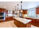 Modern kitchen features stainless steel appliances, a large island with granite countertops, and ample cabinetry at 1438 E Mesquite St, Gilbert, AZ 85296