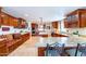 Spacious kitchen with custom wood cabinetry, granite countertops, and stainless steel appliances at 1438 E Mesquite St, Gilbert, AZ 85296
